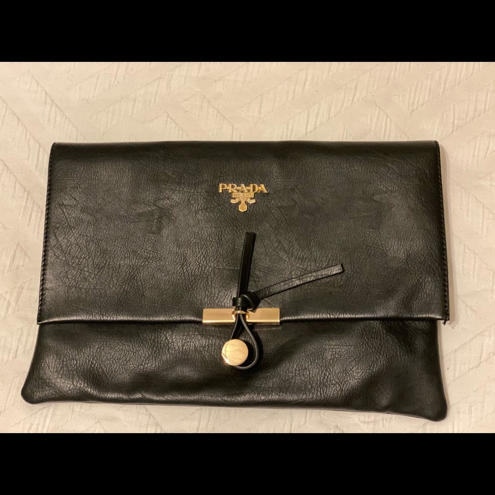 Prada Black Leather Clutch with gold hardware.